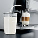 Jura glass milk container for automatic coffee machines, 16.7 oz, connected to a Jura machine making a latte