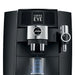 Jura J8 twin residential automatic coffee machine, close-up of the coffee spout with Coffee Eye display lit