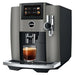 Jura S8 residential automatic coffee machine in dark inox, angled left view with a glass of coffee under the spout