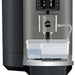 Jura X10 commercial automatic coffee machine, front close-up of the clear milk container and milk spout