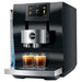 Jura Z10 residential automatic coffee machine in black, angled view with illuminated water tank and two espressos