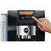 Jura Z10 residential automatic coffee machine in black, close-up of a finger selecting a drink on the touchscreen