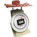 Kilotech KAM Series dial portioning scale shown weighing ground meat on red checkered paper, angled view