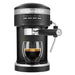 KitchenAid KES6403BM matte black semi-automatic espresso machine brewing espresso into a glass, front