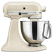 KitchenAid KSM150PSAC Artisan 5 quart tilt-head stand mixer in almond cream with stainless steel bowl, side view