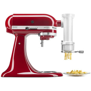 KitchenAid KSMPEXTA gourmet pasta press attached to a red stand mixer, extruding fresh pasta onto a plate