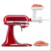 KitchenAid KSMSSA sausage stuffer kit fitted to a food grinder on a red stand mixer making fresh sausages
