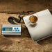 LEM 1167 330 lb stainless steel shipping scale on a wooden table weighing a bowl, with its digital display unit