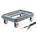 Metro MLD1 food carrier dolly in grey plastic with four swivel casters and black securing strap, angled view