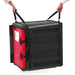 Metro MLS1 adjustable carrying strap in black, shown lifting a red and black insulated food carrier by two handles