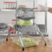 Nemco 55650 series Easy Lettuce Cutter in use, gloved hand pressing lettuce through blades into a clear bin