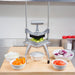 Nemco 56500 series Easy Chopper 2 in use on a prep table, with bowls of diced onions, carrots and tomatoes