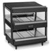 Nemco 6480 series heated pass through station, wider black model with two slanted wire shelves, angled front view