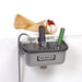 Nemco 77316 series ice cream dipper well, stainless steel with faucet shown holding scoops next to a waffle cone
