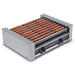 Nemco 8018 series hot dog roller grill, 10 rollers loaded with hot dogs, stainless steel housing, angled view
