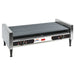 Nemco 8050SX-RC hot dog grill with Gripsit rollers and digital temperature readout, stainless steel on legs, angled view