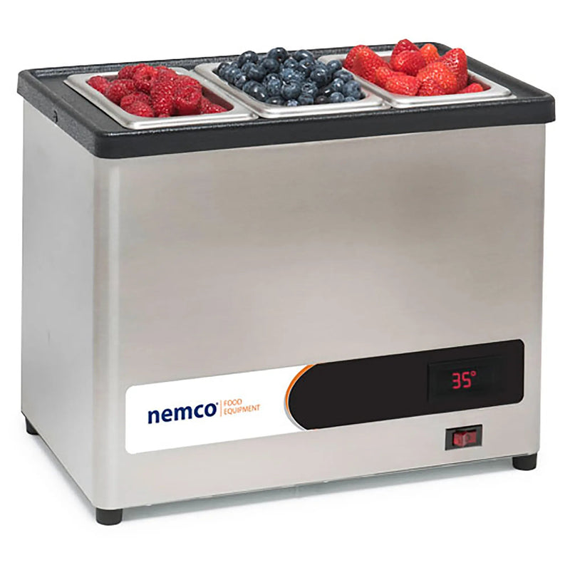 Nemco 9020 condiment chiller, stainless steel with digital display, shown with pans of fresh berries, angled view
