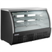 Nordic Air DDC-64 64-inch curved glass refrigerated deli case with black exterior and glass shelves, angled view