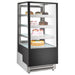 Nordic Air NPC-24 square glass three tier 26-inch refrigerated pastry display case stocked with cakes
