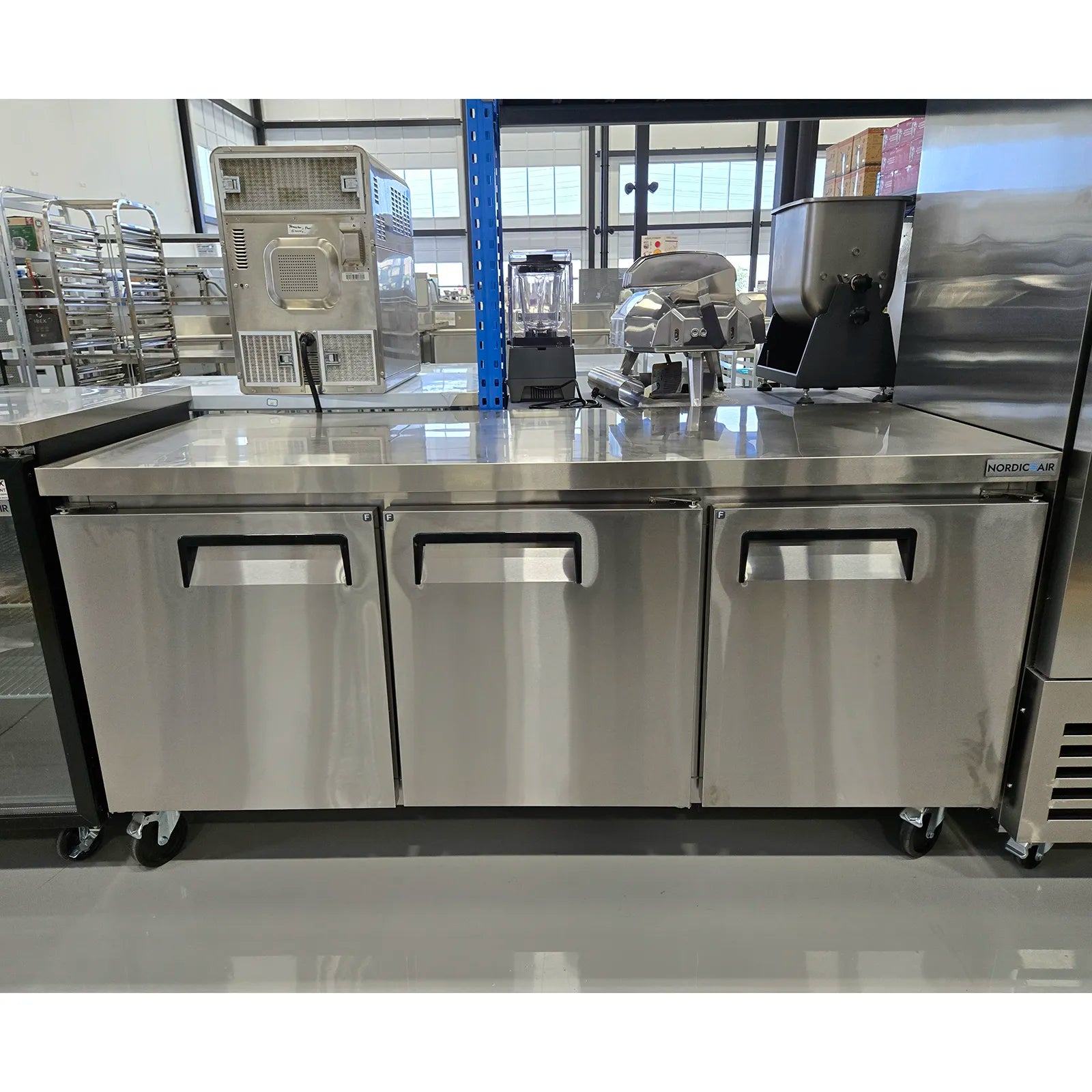 **OPEN BOX** Nordic Air Triple Door 72" Freezer Work Table-Phoenix Food Equipment