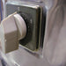 Omcan 13443 electric 22 lb potato peeler, close-up of the grey rotary on/off switch mounted on the stainless steel body