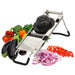 Omcan 13659 stainless steel mandoline slicer set shown with sliced onions, tomatoes, eggplant and fresh vegetables