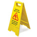 Omcan 24415 yellow plastic fold-out wet floor caution sign with bilingual English and French warning text