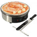 Omcan 39579 electric 14-inch crepe maker shown in use with a crepe topped with sauce, bananas and spreader