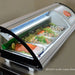 Omcan 43223 refrigerated 45-inch sushi showcase shown in use displaying fresh sushi and salmon on trays