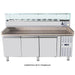 Omcan 46680 refrigerated 79-inch topping rail with glass sneeze guard shown mounted on a granite top prep table