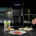 Omcan 47755 Pacojet 4 food processor shown in a restaurant kitchen with plated dishes and a green puree in a beaker