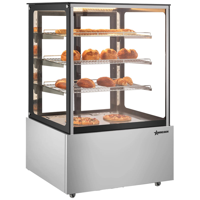 Omcan 48390 35-inch square glass floor display warmer with 3 shelves stocked with pastries, angled view