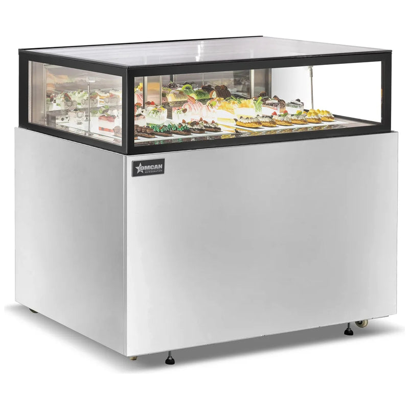 Omcan 48562 48-inch stainless steel flat top refrigerated pastry showcase stocked with cakes and desserts, angled view