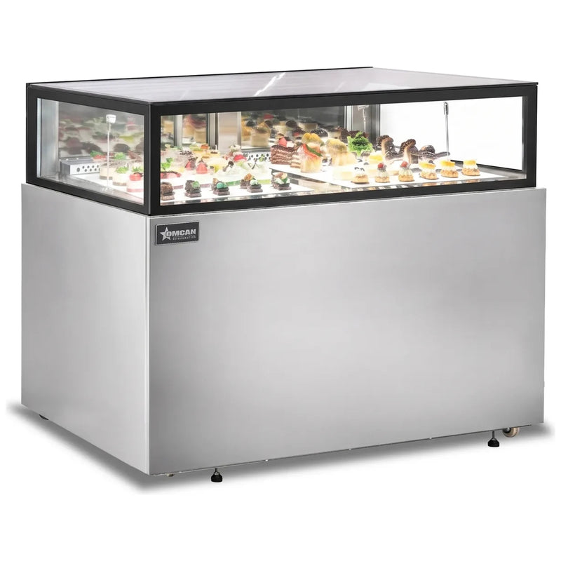 Omcan 48563 60-inch stainless steel flat top refrigerated pastry showcase stocked with cakes and desserts, angled view