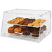 Omcan 80567 2-tray acrylic bakery display case stocked with muffins and cookies, angled view