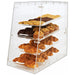 Omcan 80569 4-tray acrylic bakery display case stocked with croissants and cookies, angled view