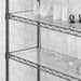 Phoenix clear PVC mats installed on black wire shelving, shown in use holding glasses, cups and stemware