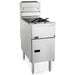 Pitco SG14S gas floor fryer in stainless steel with two fry baskets and lower cabinet door, angled front view