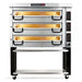 PizzaMaster PM83 electric 48-inch wide three deck pizza oven in stainless steel on a black stand with casters