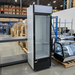 Scratch and dent Duracold P430WA 24-inch single glass door display refrigerator in black and white, angled warehouse view