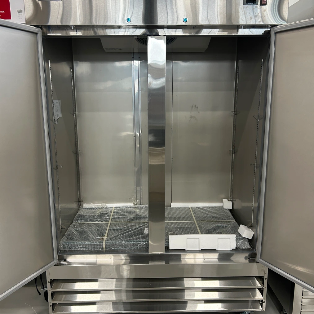 Open box Nordic Air SR-54 double door refrigerator, front view with both doors open and the new shelves still wrapped