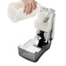 San Jamar S1300TBK manual soap dispenser with cover open, hand pouring liquid soap into the white 1300ml reservoir