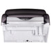 San Jamar T8000TBK compact touchless roll paper towel dispenser, underside view of the white towel outlet and roller