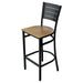 Tarrison Aria bar stool with black metal frame, slotted back, footrest and natural wood seat, angled view