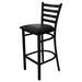 Tarrison Spencer ladder back bar stool with black metal frame, footrest ring and black vinyl upholstered seat