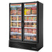 True FLM-54F~TSL01 54-inch black double door full length glass display freezer stocked with frozen foods