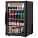 True GDM-06-34-HC~TSL01 21-inch black single glass door countertop display refrigerator stocked with drinks