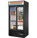 True GDM Series 40-inch black double glass door display refrigerator with sliding doors, stocked with dairy