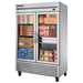 True T-49FG-HC~FGD01 54" wide two glass door display freezer on casters, stocked with frozen boxed foods