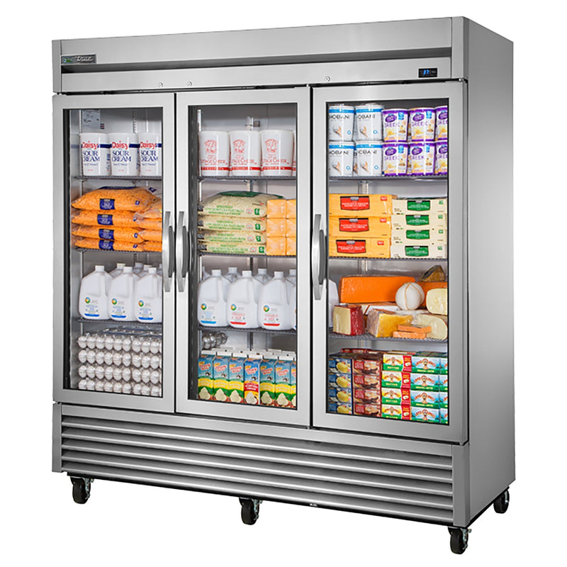 True T-72G-HC~FGD01 78" wide three glass door display refrigerator stocked with milk, eggs and groceries